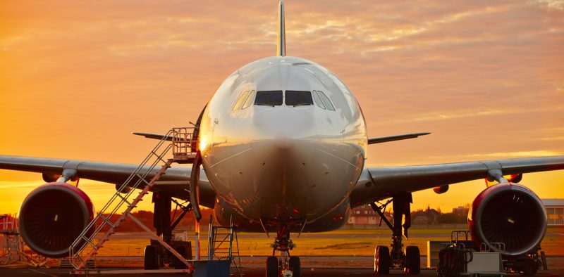 Aircraft service - large aircraft at the beautiful sunrise